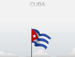 The Cuban flag is flying on a pole that stands tall under the white sky vector