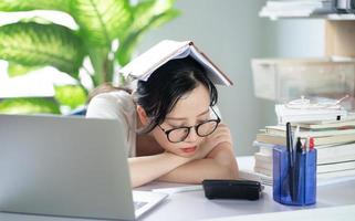 Asian young girl doing homework photo