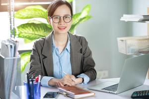 Asian businesswoman working from home photo