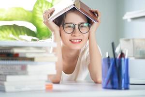 Asian young girl doing homework photo