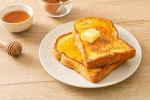 French toasted with butter and honey photo