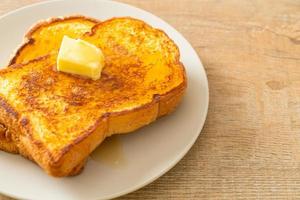 French toasted with butter and honey photo