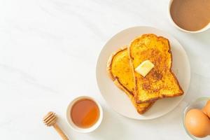 French toasted with butter and honey photo