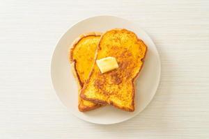 French toasted with butter and honey photo