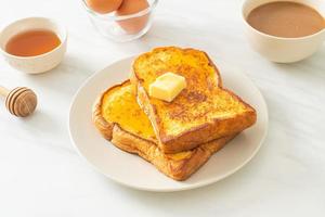 French toasted with butter and honey photo