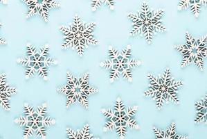 White snow decorations on a blue background photo