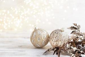 Golden christmas balls with bokeh photo