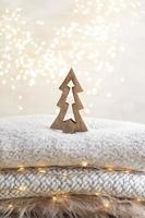 Christmas little trees and golden lights bokeh photo