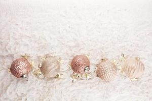 Golden christmas balls with wool background photo