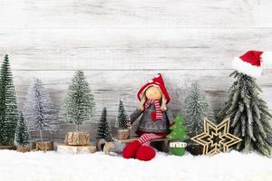 Christmas tree on wooden background photo