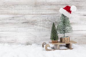 Christmas tree on wooden background photo