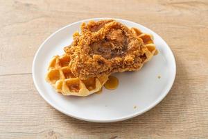 fried chicken waffle with honey or maple syrup photo