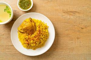 Chicken Biryani or Curried rice and chicken - Thai-Muslim version of Indian biryani, with fragrant yellow rice and chicken photo