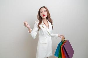 portrait beautiful Asian woman holding shopping bag photo