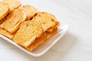 baked crispy bread with butter and sugar photo