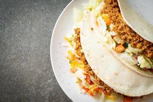 Mexican tacos with minced chicken photo