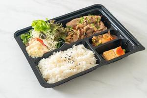 Japanese rice with pork yaki bento set photo