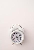 White retro alarm clock isolated on white background with copy space photo