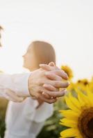 Close up couple holding hands outdoors photo