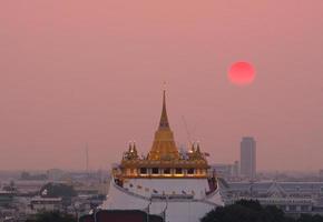 Landscape of The golden mount of Wat Saket at sunset photo