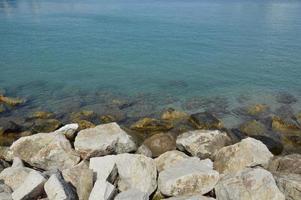 Large cobblestones on the Mediterranean coast photo