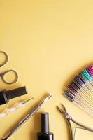 Flat lay manicure tools on a colored background with copy space photo