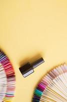 Flat lay manicure tools on a colored background with copy space photo