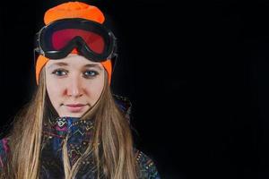 Portrait of girl with ski mask and snowboard photo