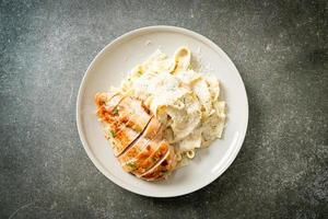 fettucine pasta white creamy sauce with grilled chicken photo