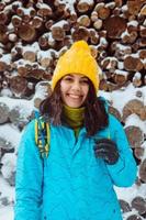 Portrait of pretty woman in yellow hat and winter clothes photo