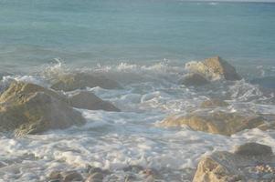 Stones on the background of the Aegean storm on the island of Rhodes in Greece photo