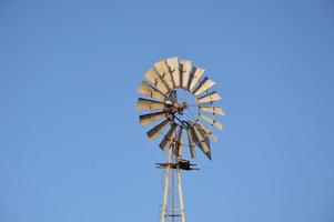 Windmill for generating electricity in the fields of Rhodes in Greece photo