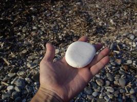 Stones and pebbles of the Aegean Sea on the island of Rhodes in Greece photo