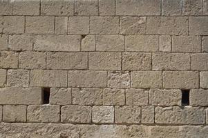 Texture of ancient masonry walls in Rhodes island in Greece photo