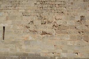Texture of ancient masonry walls in Rhodes island in Greece photo
