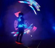 Laser show performance, dancers in led suits with LED lamp, very beautiful night club performance, party photo