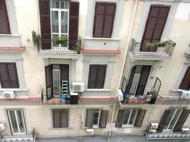 Windows, balconies and shutters of an Italian apartment building photo