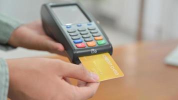 Close - up shot of Employees accept credit card payments via EDC. photo