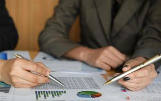 The female accountant team is calculating the budget to present executives. photo