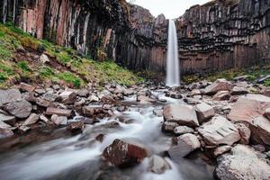 Great view of Svartifoss waterfall. Dramatic and picturesque scene. Popular tourist attraction. Iceland photo
