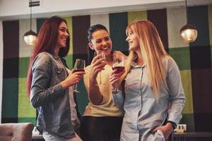 Picture presenting happy group of friends with red wine photo