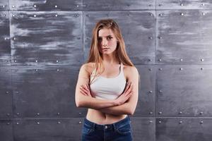 Image of young female against gray studio background photo