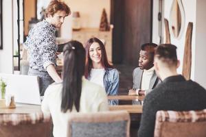 Group of casually dressed businesspeople discussing ideas. Creative professionals gathered for discuss the important issues of the new successful startup project. Teamwork Brainstorming Concept photo