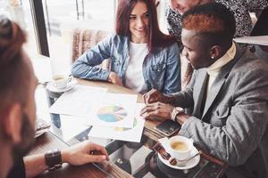 Group of casually dressed businesspeople discussing ideas. Creative professionals gathered for discuss the important issues of the new successful startup project. Teamwork Brainstorming Concept photo