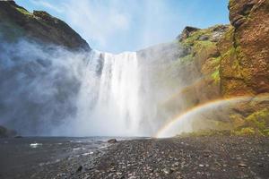 Great waterfall Skogafoss in south of Iceland near the town of Skogar. Dramatic and picturesque scene photo