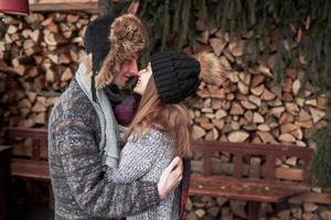 Happy Young Couple in Winter Park having fun.Family Outdoors. photo