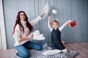 Happy loving family. Mother and her daughter child girl playing together photo