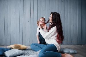 Happy loving family. Mother and her daughter child girl playing together photo