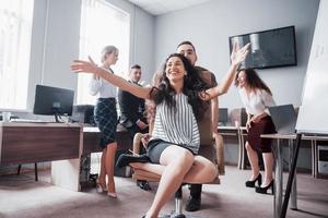 Happy young colleagues smile and have fun at the creative office. photo