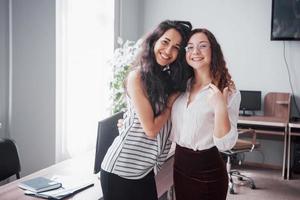 Young women are at work in the office photo